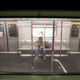 A passenger sits in a stalled train during a disruption of subway services by protesters at Fortress Hill station in Hong Kong, Aug. 5, 2019.